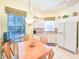 Inviting kitchen nook with a breakfast table and well-lit cabinets at 1187 Athlone Way, Ormond Beach, FL 32174