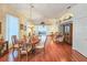 Open concept living and dining area with hardwood floors, lots of light, and neutral decor at 1187 Athlone Way, Ormond Beach, FL 32174