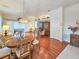 Open-concept living room and dining room with hardwood floors and neutral decor at 1187 Athlone Way, Ormond Beach, FL 32174