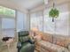Inviting sunroom with comfortable seating, bright windows, and a peaceful atmosphere at 1187 Athlone Way, Ormond Beach, FL 32174