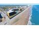 Aerial view of oceanfront hotel property with direct beach access and pool at 2301 S Atlantic Ave # 230, Daytona Beach, FL 32118