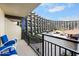 Balcony overlooking the pool area of the hotel with seating for relaxing at 2301 S Atlantic Ave # 230, Daytona Beach, FL 32118