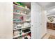 Linen closet with organized shelving provides plenty of space for towels and storage at 2301 S Atlantic Ave # 230, Daytona Beach, FL 32118
