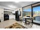 Compact kitchen with black appliances, white cabinetry and natural light at 2301 S Atlantic Ave # 230, Daytona Beach, FL 32118