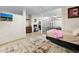Bright living space features neutral decor, tile flooring, and a unique glass block partition at 2301 S Atlantic Ave # 230, Daytona Beach, FL 32118