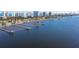 Waterfront homes featuring private docks, with views of the city skyline on a sunny day at 2912 River Point Dr, Daytona Beach, FL 32118