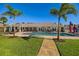 Beautiful backyard featuring a pool, well-manicured lawn, and lovely landscaping at 2912 River Point Dr, Daytona Beach, FL 32118
