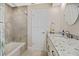 Bright bathroom with white cabinets, granite countertop sink, and modern bathtub at 2912 River Point Dr, Daytona Beach, FL 32118