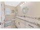 Bright bathroom featuring a modern vanity, decorative mirror, and updated fixtures at 2912 River Point Dr, Daytona Beach, FL 32118