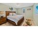 This quaint bedroom features beautiful decor, a ceiling fan, and an area rug at 2912 River Point Dr, Daytona Beach, FL 32118