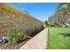 Beautiful lush landscape with a stone house and a brick walkway leading to the front door at 2912 River Point Dr, Daytona Beach, FL 32118