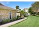 A charming stone home with manicured lawn and a stone walkway at 2912 River Point Dr, Daytona Beach, FL 32118