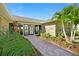 Beautiful stone home featuring a stone walkway to the double-door entrance at 2912 River Point Dr, Daytona Beach, FL 32118