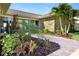 Stunning stone home featuring a stone walkway to the glass double-door entrance at 2912 River Point Dr, Daytona Beach, FL 32118