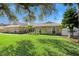 Charming stone home with manicured lawn and mature landscaping at 2912 River Point Dr, Daytona Beach, FL 32118