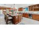 Gourmet kitchen featuring a large center island, granite countertops, and custom cabinetry at 2912 River Point Dr, Daytona Beach, FL 32118
