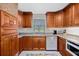 Charming kitchen featuring granite countertops, stylish wood cabinetry, and modern appliances at 2912 River Point Dr, Daytona Beach, FL 32118
