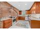Charming kitchen featuring a brick accent wall, custom cabinetry, and modern appliances at 2912 River Point Dr, Daytona Beach, FL 32118