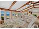 Bright living room featuring vaulted wood ceilings, ceiling fan, and lovely outdoor views at 2912 River Point Dr, Daytona Beach, FL 32118