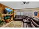 This great living room features wood walls, comfortable couches, and a large tv at 2912 River Point Dr, Daytona Beach, FL 32118