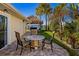 Cozy patio with outdoor seating, tiki hut, and lush landscaping at 2912 River Point Dr, Daytona Beach, FL 32118