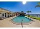 Inviting backyard pool area with a tiki hut, lush landscaping, and picturesque waterfront views at 2912 River Point Dr, Daytona Beach, FL 32118