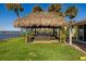 Tiki hut with hot tub overlooking waterfront at 2912 River Point Dr, Daytona Beach, FL 32118