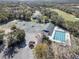 Aerial view of community amenities, including tennis courts and swimming pool at 3257 Bailey Ann Dr, Ormond Beach, FL 32174