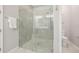 Bathroom featuring a large glass shower with tile surround and a toilet at 3257 Bailey Ann Dr, Ormond Beach, FL 32174