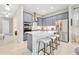 A kitchen with stainless steel appliances, gray cabinets, and a center island with bar stool seating at 3257 Bailey Ann Dr, Ormond Beach, FL 32174