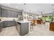 A modern kitchen flows seamlessly into a dining and living area, offering an open and inviting space at 3257 Bailey Ann Dr, Ormond Beach, FL 32174