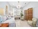 Comfortable living area with a daybed, decorative screen, and a window, creating a relaxing and stylish atmosphere at 3257 Bailey Ann Dr, Ormond Beach, FL 32174
