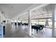 Covered outdoor dining area with tables, chairs, and views of the golf course at 3257 Bailey Ann Dr, Ormond Beach, FL 32174