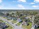 Neighborhood aerial view highlighting lush greenery, tidy streets, and neatly arranged residential houses at 348 Southern Winds Blvd, Deland, FL 32720