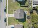 Aerial view showcasing the property's layout with a stone-paved patio and surrounding green space at 348 Southern Winds Blvd, Deland, FL 32720
