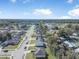 Aerial view of a suburban neighborhood featuring well-maintained homes and tree-lined streets at 348 Southern Winds Blvd, Deland, FL 32720