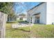 Private backyard with a stone-paved patio, trampoline, and potential for outdoor enjoyment at 348 Southern Winds Blvd, Deland, FL 32720