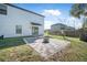 Backyard featuring a stone-paved patio, ideal for outdoor lounging and entertainment at 348 Southern Winds Blvd, Deland, FL 32720