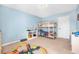 Comfortable bedroom featuring a wooden bunk bed and a window, providing a great view of the outdoors at 348 Southern Winds Blvd, Deland, FL 32720