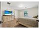 Serene bedroom with a dresser and TV, a comfortable bed, and a relaxing atmosphere at 348 Southern Winds Blvd, Deland, FL 32720