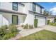 Charming two-story home featuring a manicured lawn and a convenient two-car garage at 348 Southern Winds Blvd, Deland, FL 32720