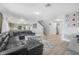 Inviting living room adjacent to an open kitchen offering seamless flow and modern living at 348 Southern Winds Blvd, Deland, FL 32720
