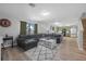 Inviting living room adjacent to an open kitchen offering seamless flow and modern living at 348 Southern Winds Blvd, Deland, FL 32720