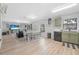Spacious living area connected to the kitchen, featuring modern furnishings and light-filled windows at 348 Southern Winds Blvd, Deland, FL 32720