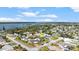 Panoramic aerial view highlighting the home's location near a scenic river with community amenities at 4 Water Oak Cir, Ormond Beach, FL 32176