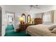 Large bedroom with a plush queen bed, neutral walls, and access to the hallway and other rooms at 4 Water Oak Cir, Ormond Beach, FL 32176