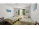 Cozy bedroom with two twin beds, neutral walls, and a shared nightstand between the beds at 4 Water Oak Cir, Ormond Beach, FL 32176