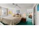 Bedroom featuring a queen bed with a wood headboard, neutral walls, and a small desk nearby at 4 Water Oak Cir, Ormond Beach, FL 32176