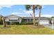 Charming single-story home with well-maintained landscaping, a two-car garage, and a welcoming facade at 4 Water Oak Cir, Ormond Beach, FL 32176