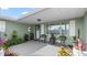 Inviting front porch featuring comfortable seating, plants, and a welcoming entrance to the home at 4 Water Oak Cir, Ormond Beach, FL 32176
